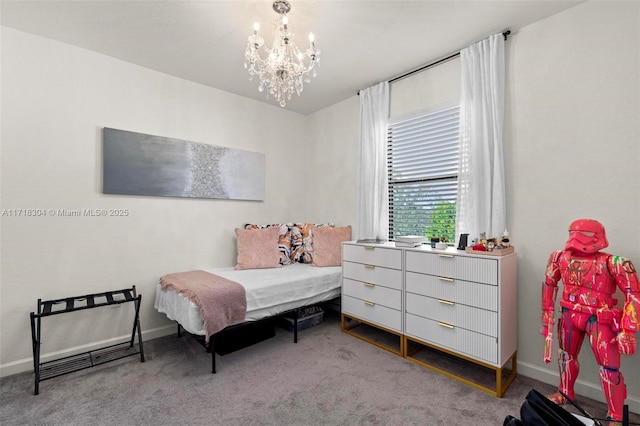 bedroom featuring carpet flooring and an inviting chandelier