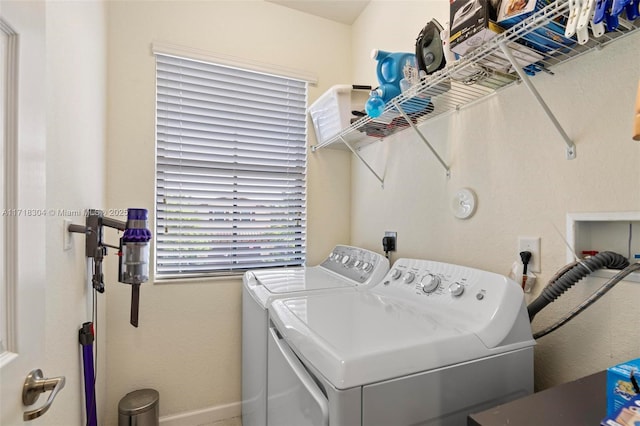 laundry area featuring washing machine and clothes dryer