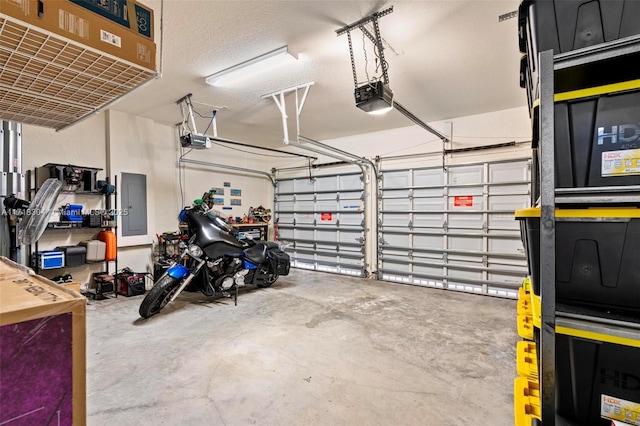 garage featuring electric panel and a garage door opener