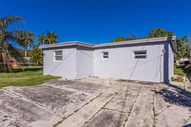 rear view of house with a lawn