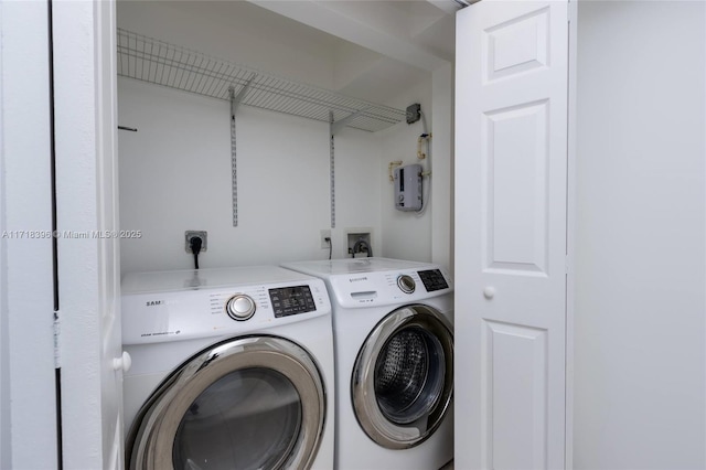 washroom with washer and dryer