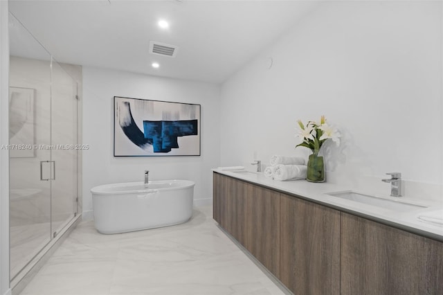 bathroom featuring separate shower and tub and vanity