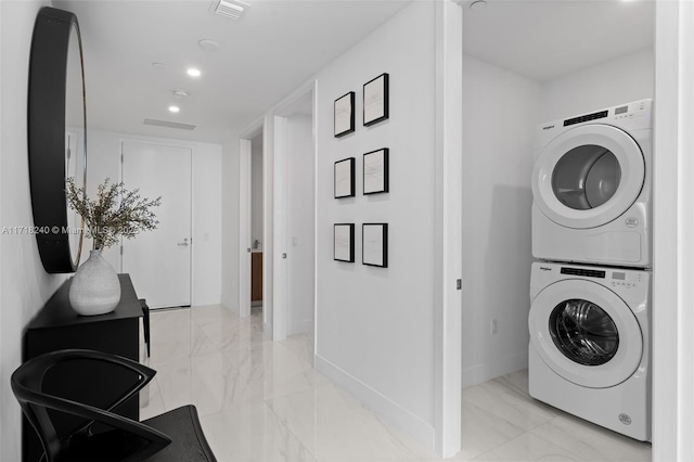 laundry room with stacked washer / dryer