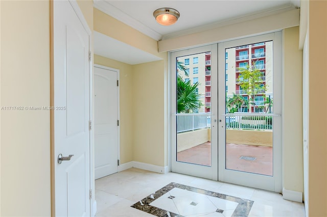 entryway featuring light tile patterned floors, french doors, and ornamental molding