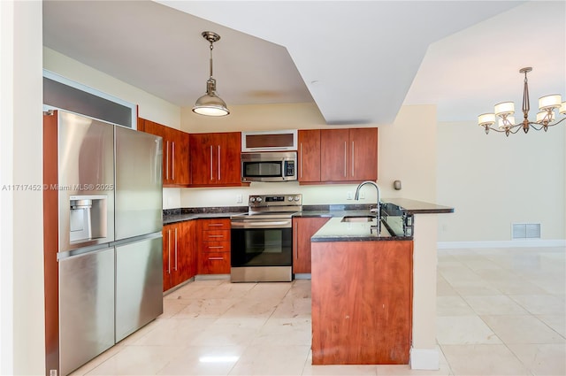 kitchen with an inviting chandelier, sink, hanging light fixtures, light tile patterned flooring, and stainless steel appliances