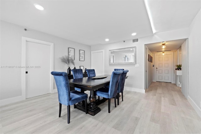 dining area with light wood-type flooring