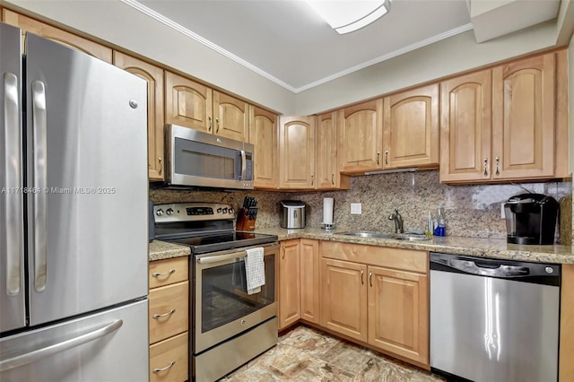 kitchen with sink, stainless steel appliances, light stone counters, backsplash, and ornamental molding