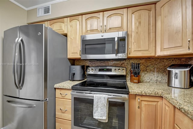 kitchen featuring decorative backsplash, light brown cabinetry, light stone countertops, stainless steel appliances, and crown molding