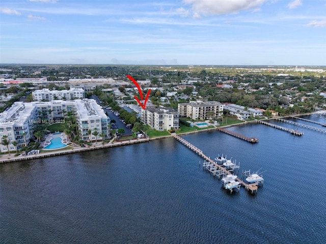 birds eye view of property with a water view