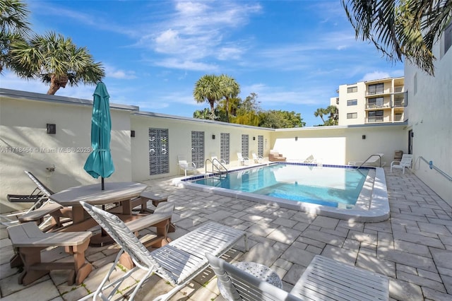 view of pool featuring a patio