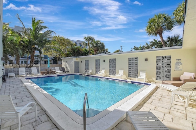 view of swimming pool featuring a patio area