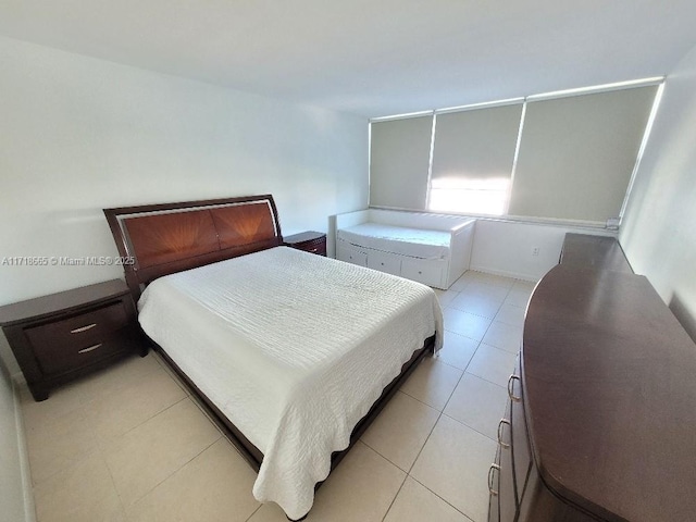 bedroom featuring light tile patterned floors