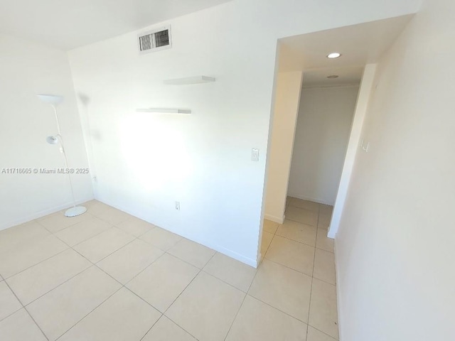 empty room with light tile patterned flooring