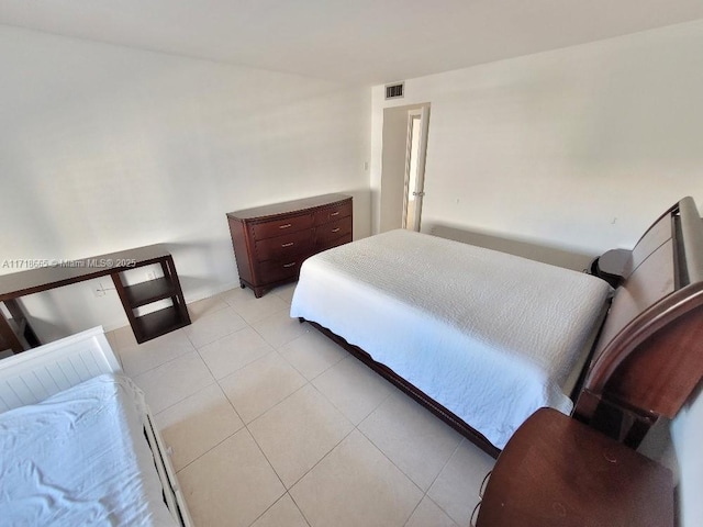 bedroom featuring light tile patterned floors