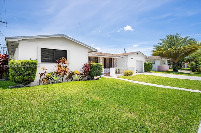 view of front facade with a garage and a front yard