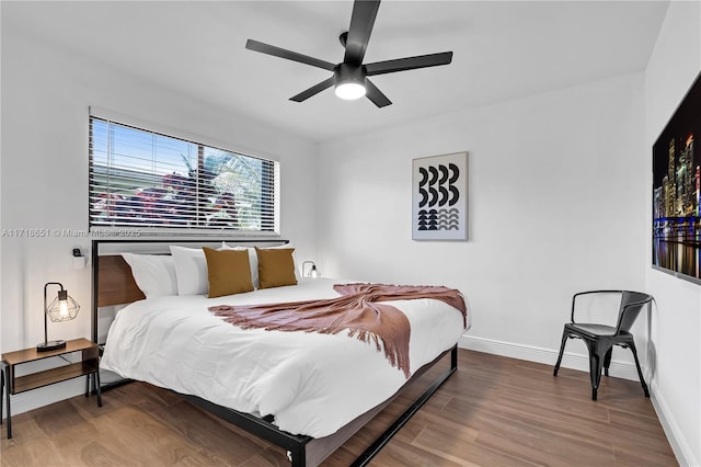 bedroom featuring ceiling fan and wood-type flooring