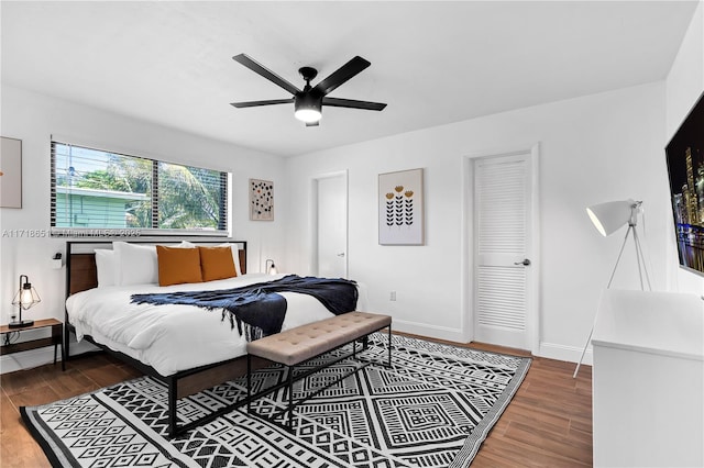 bedroom with wood-type flooring and ceiling fan