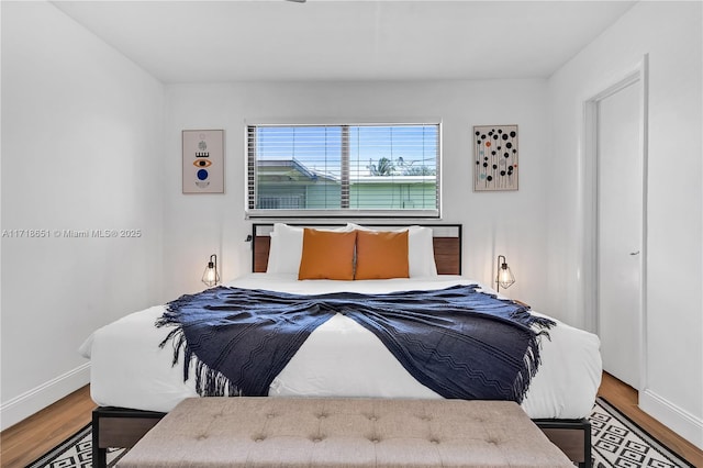 bedroom featuring wood-type flooring