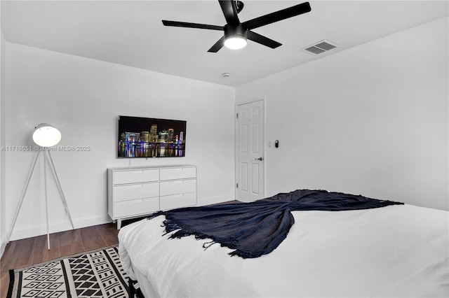 bedroom featuring dark wood-type flooring and ceiling fan