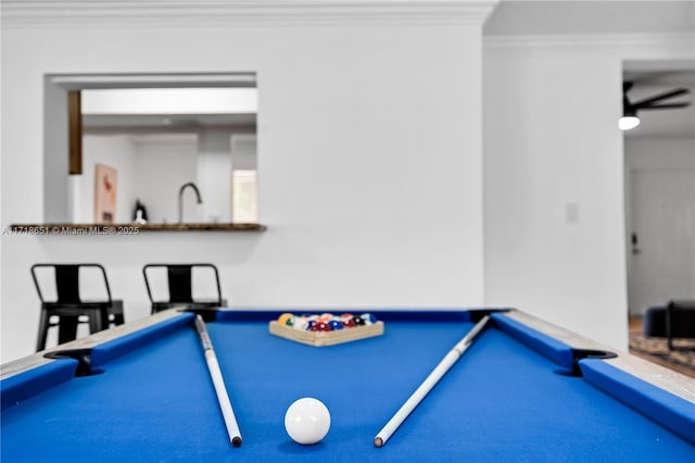 rec room with crown molding, billiards, and sink