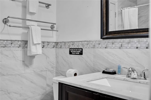 bathroom featuring vanity and a shower with shower curtain