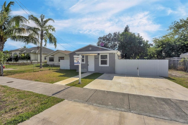 ranch-style home with a front yard