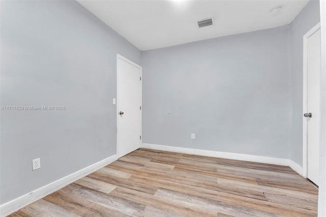 unfurnished room featuring light hardwood / wood-style floors