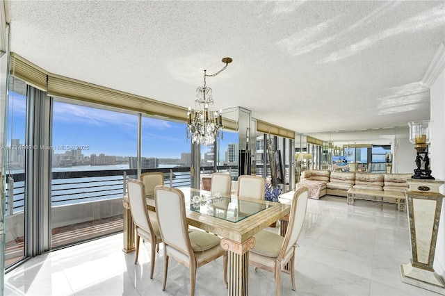 dining area with a wall of windows, a textured ceiling, and a chandelier