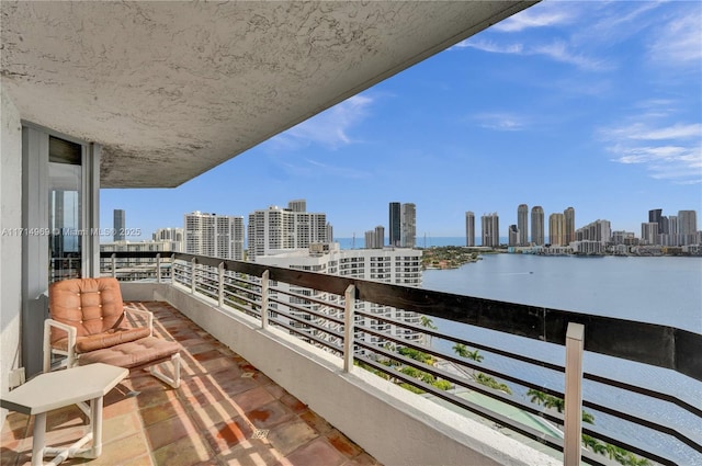 balcony featuring a water view