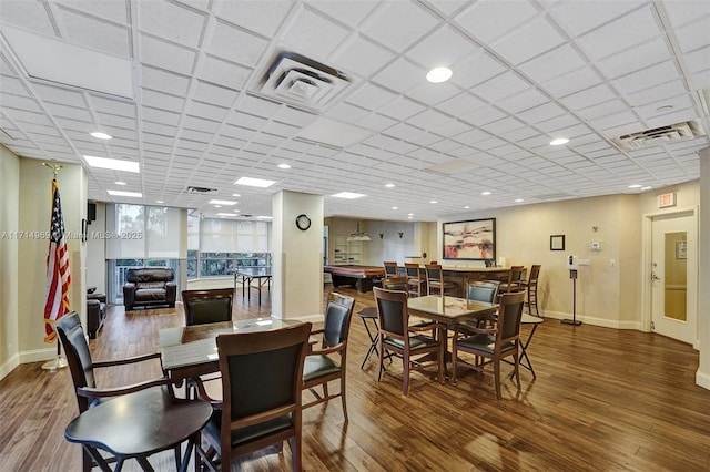 dining room with dark hardwood / wood-style flooring