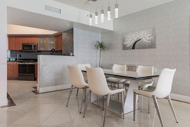 dining area featuring sink