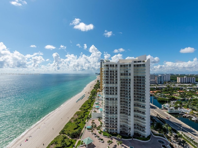 aerial view with a view of the beach and a water view