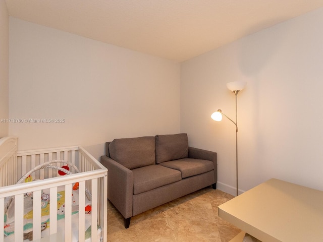 bedroom with a nursery area