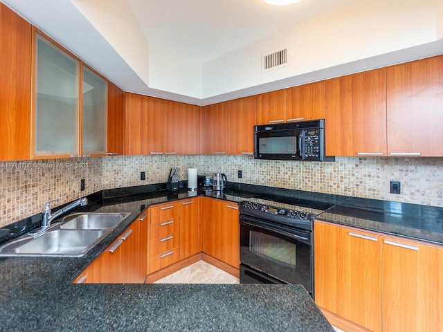 kitchen featuring black appliances, light tile patterned floors, sink, and tasteful backsplash