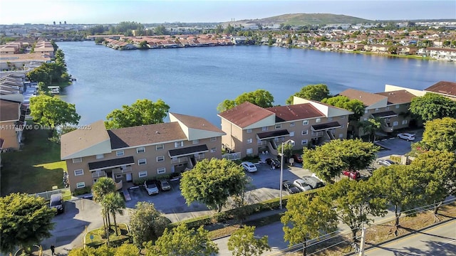 birds eye view of property featuring a water and mountain view