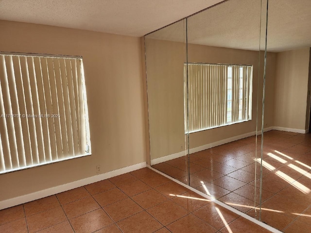 empty room featuring tile patterned flooring