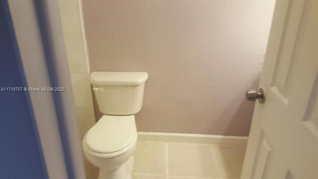 bathroom featuring tile patterned floors and toilet