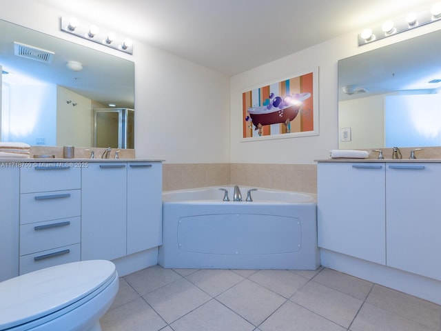 full bathroom featuring tile patterned floors, vanity, toilet, and independent shower and bath