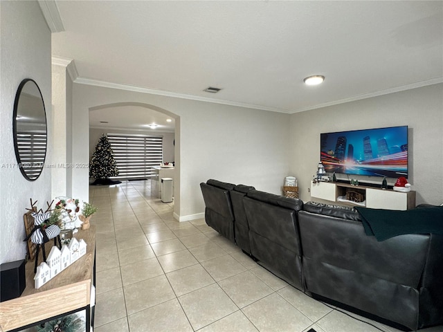 living room featuring light tile patterned floors and ornamental molding