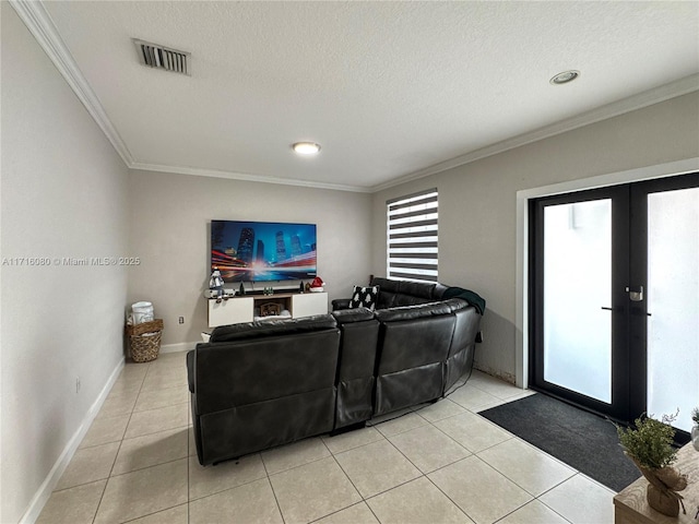 living room featuring a textured ceiling, light tile patterned flooring, and crown molding