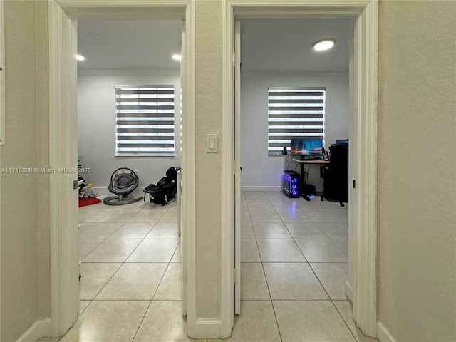 hall featuring light tile patterned floors