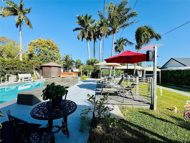 view of swimming pool featuring a patio area