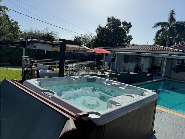 view of pool featuring a hot tub