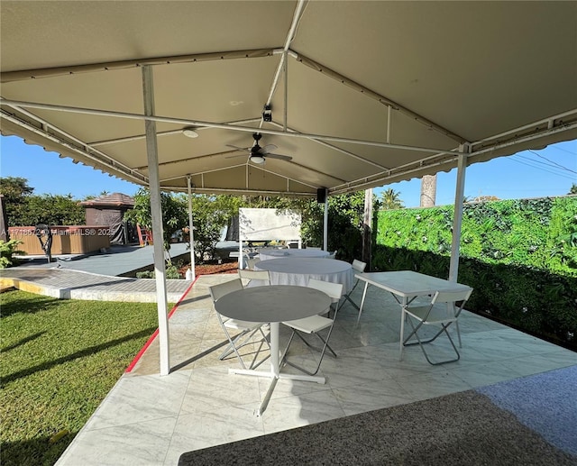 view of patio / terrace featuring ceiling fan