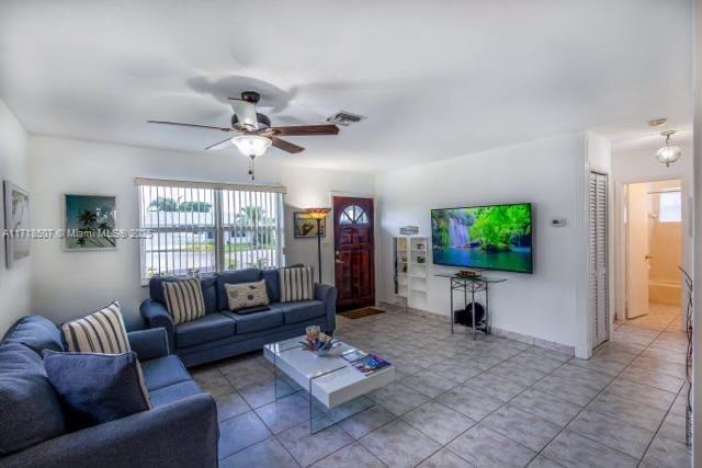 living room with ceiling fan