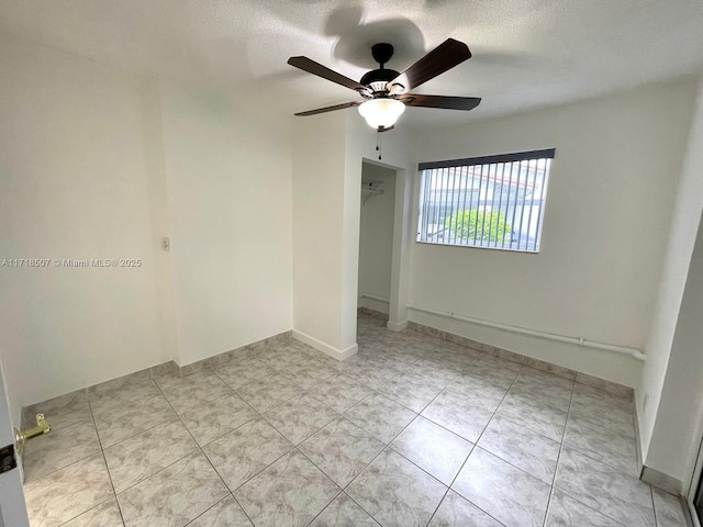 empty room with ceiling fan