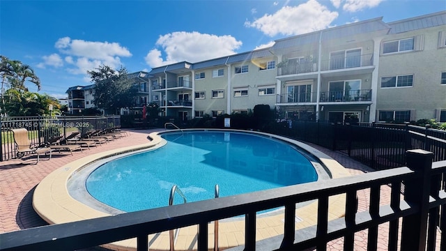 view of swimming pool featuring a patio area