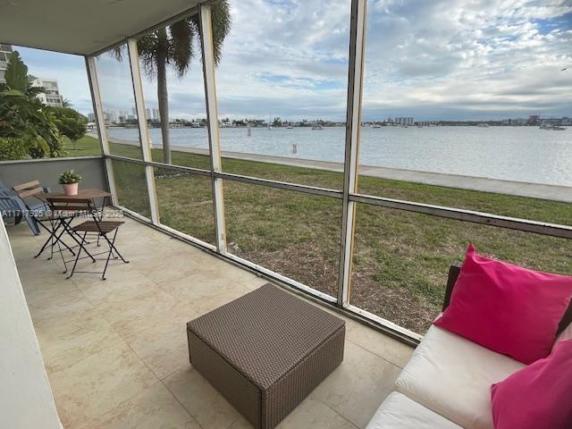 sunroom with a water view