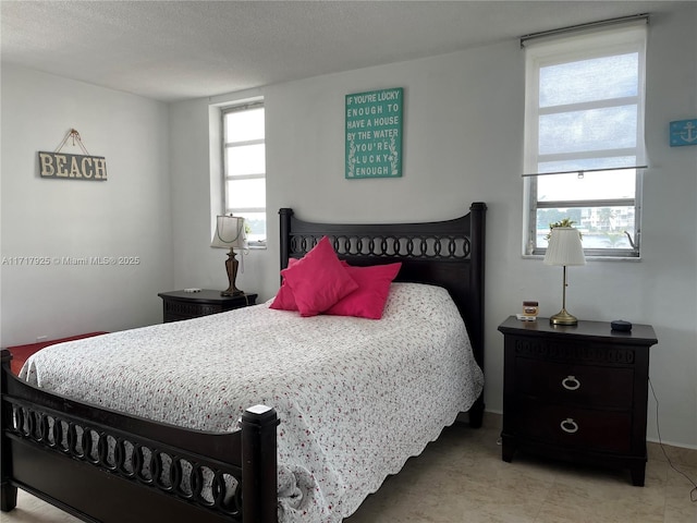 bedroom featuring a textured ceiling