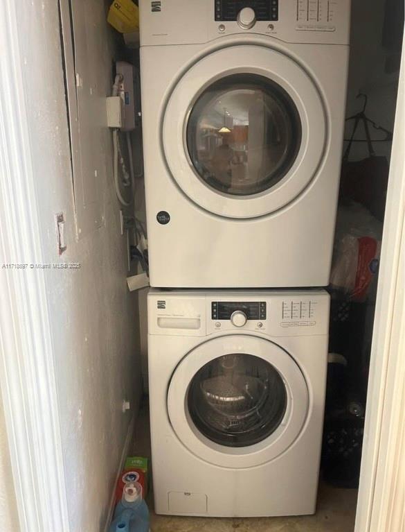 laundry room featuring stacked washer and dryer